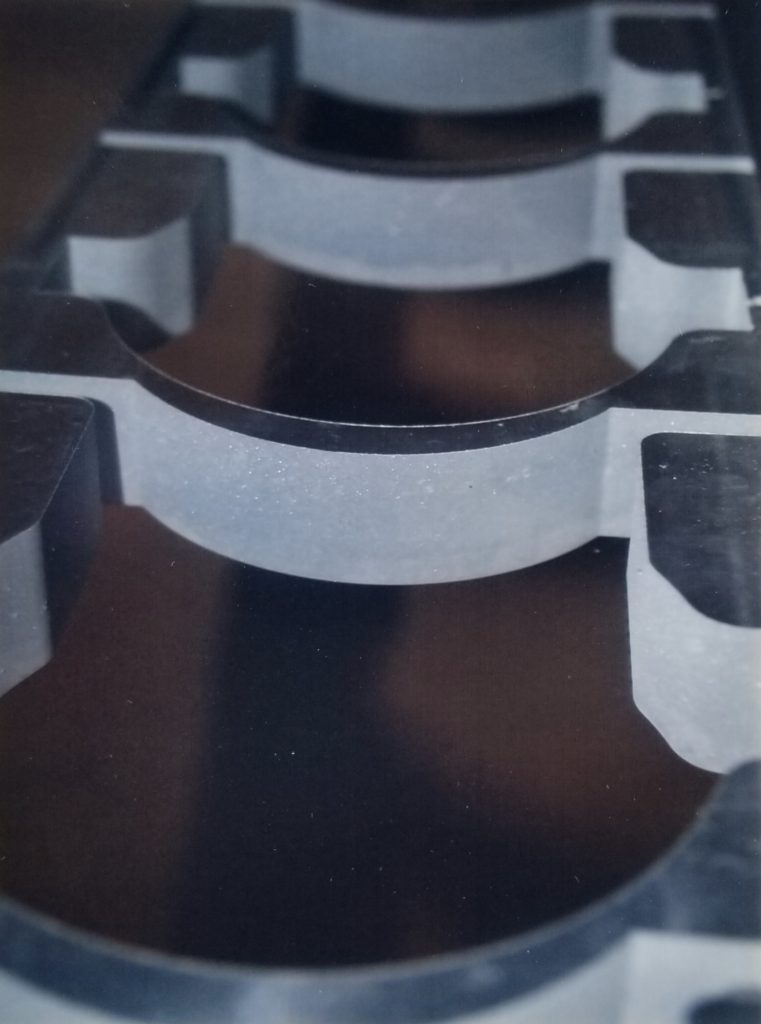 Curved precision-cut metal components